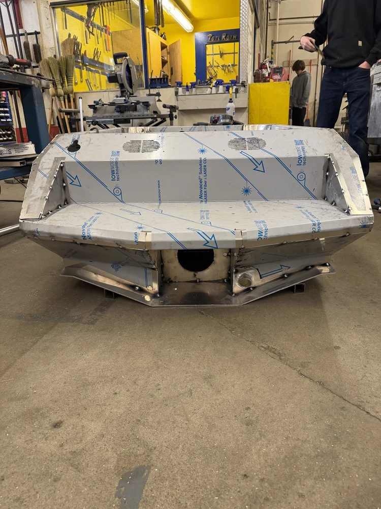 Assembled aluminum hull with protective film covering the panels