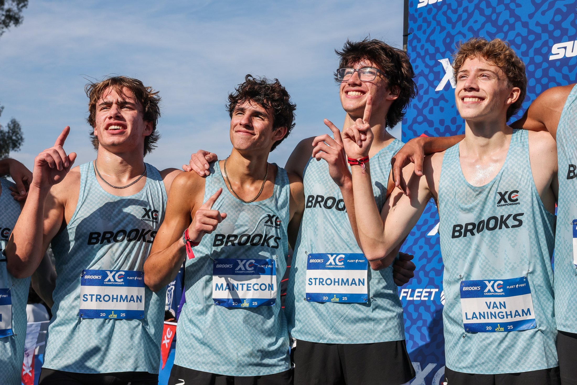 Team celebrating in Brooks XC Championships kits