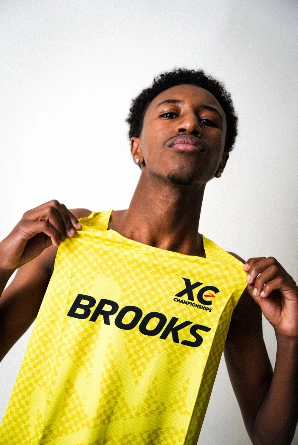Athlete in a Brooks XC singlet