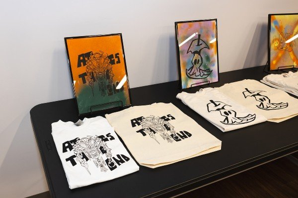 A Color Me Rad artist's design is on display as a print, t-shirt, and tote bag. Photo credit: Alex Knowbody.
