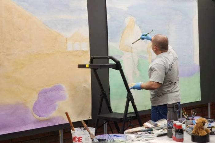 Artist Tomas "Wisper" Talamantes starts to add color to his new mural-in-progress inside New Museum Los Gatos.