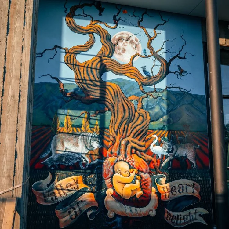 The completed design of one of Francisco Ramirez's two murals, evoking themes of growth and abundance.