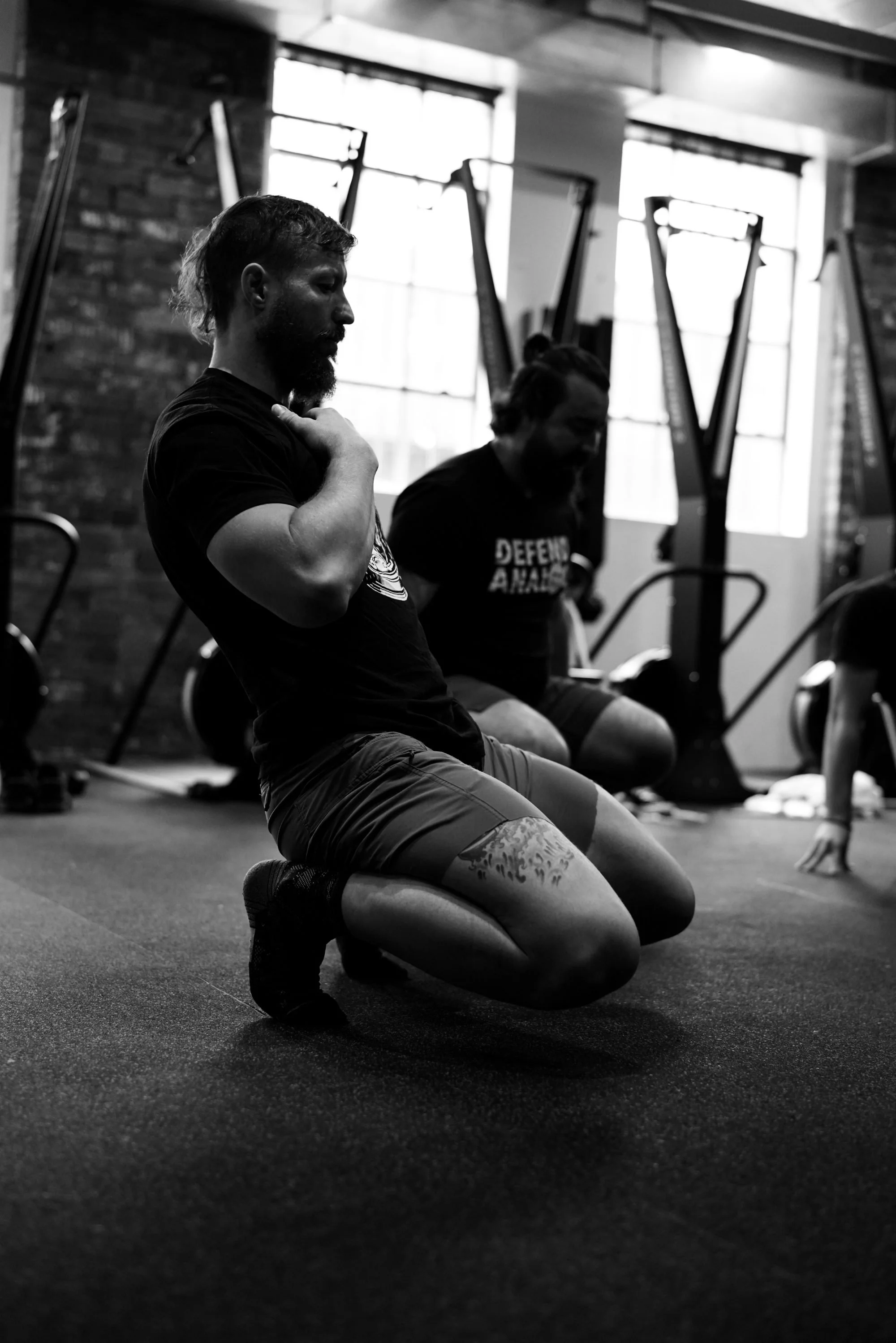 Athlete kneeling between sets