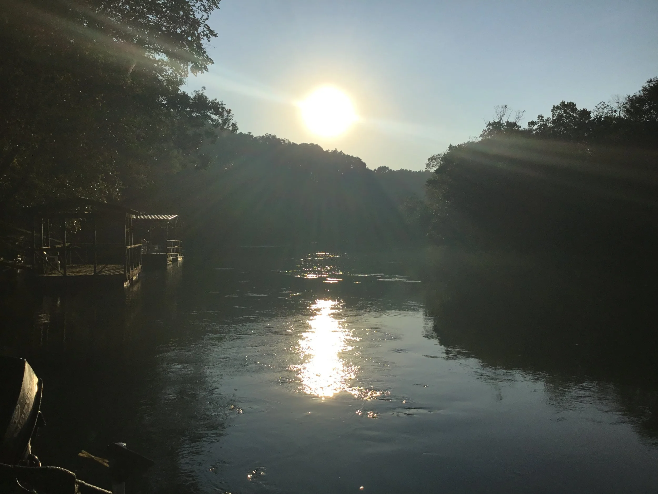 Sunlight reflecting off the Little Red River at morning sunrise