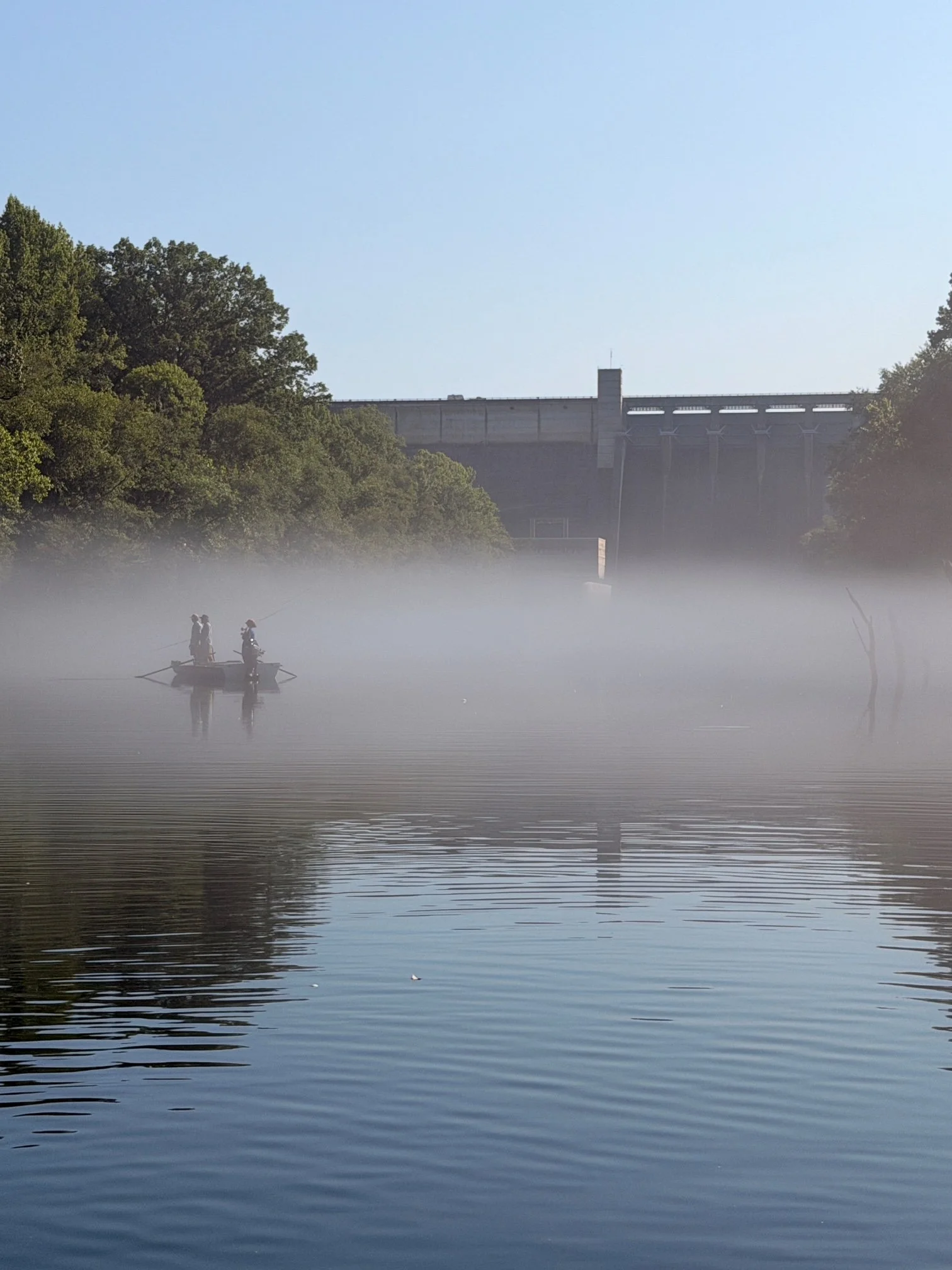 Anglers on the misty Little Red River near Greers Ferry Dam