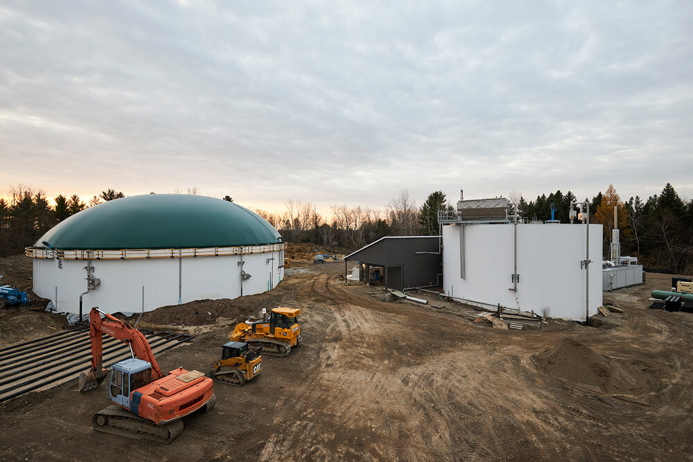 biogas plant construction site with a large structure with green dome