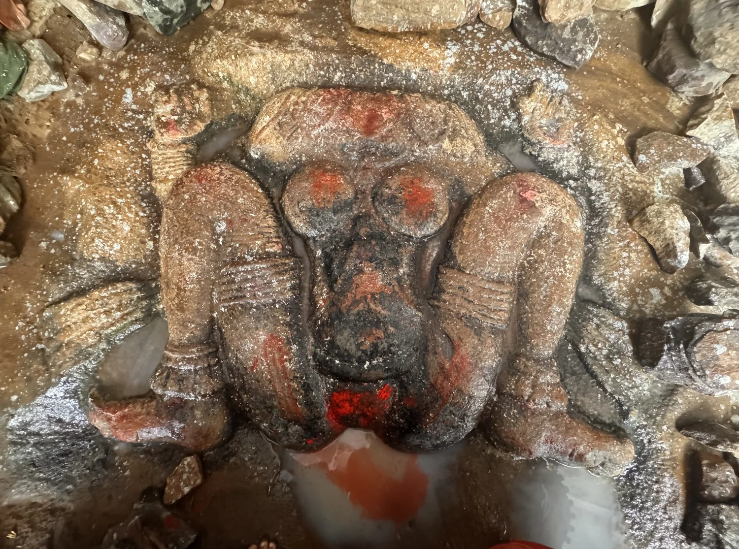 Stone image of Lajja Gauri with sindoor offerings