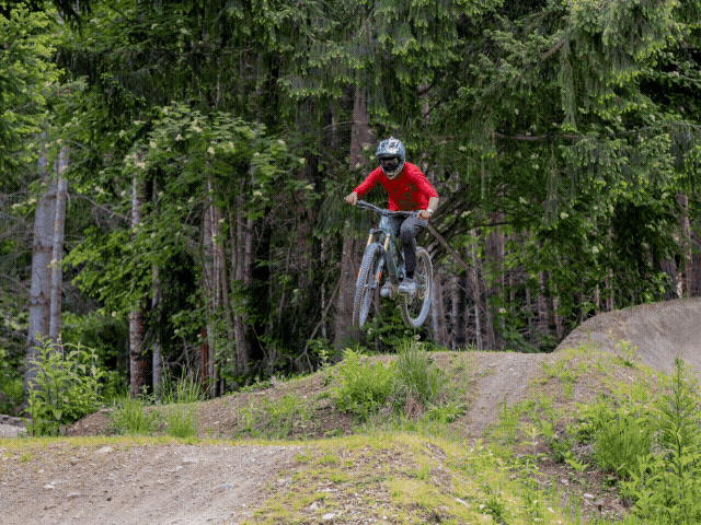 Mountain bike jump movement showing absorption and extension