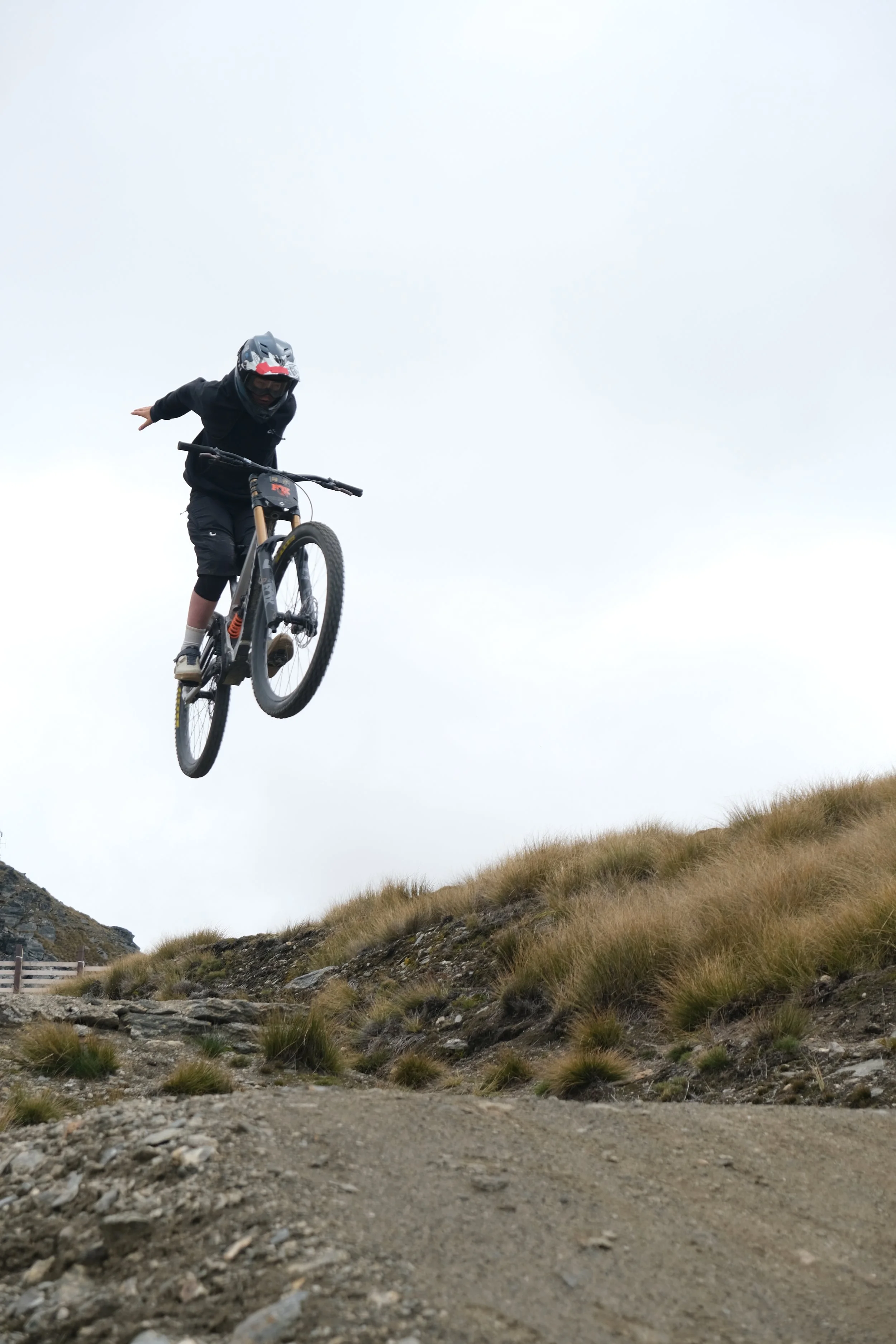 Mountain biker riding a Queenstown trail