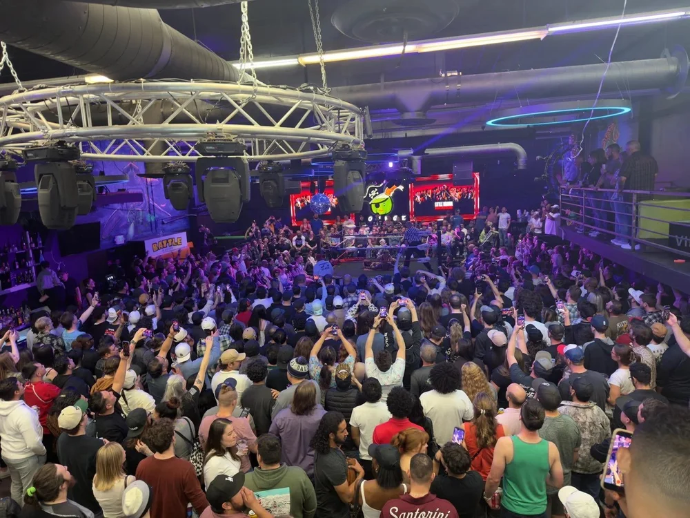 A packed nightclub crowd around the ring