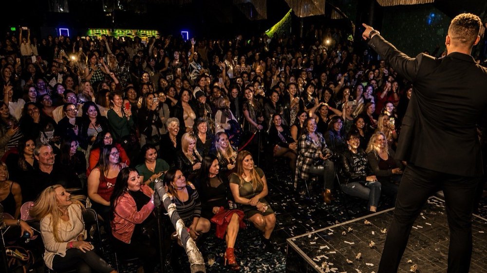 HER TAKEOVER performer over the crowd