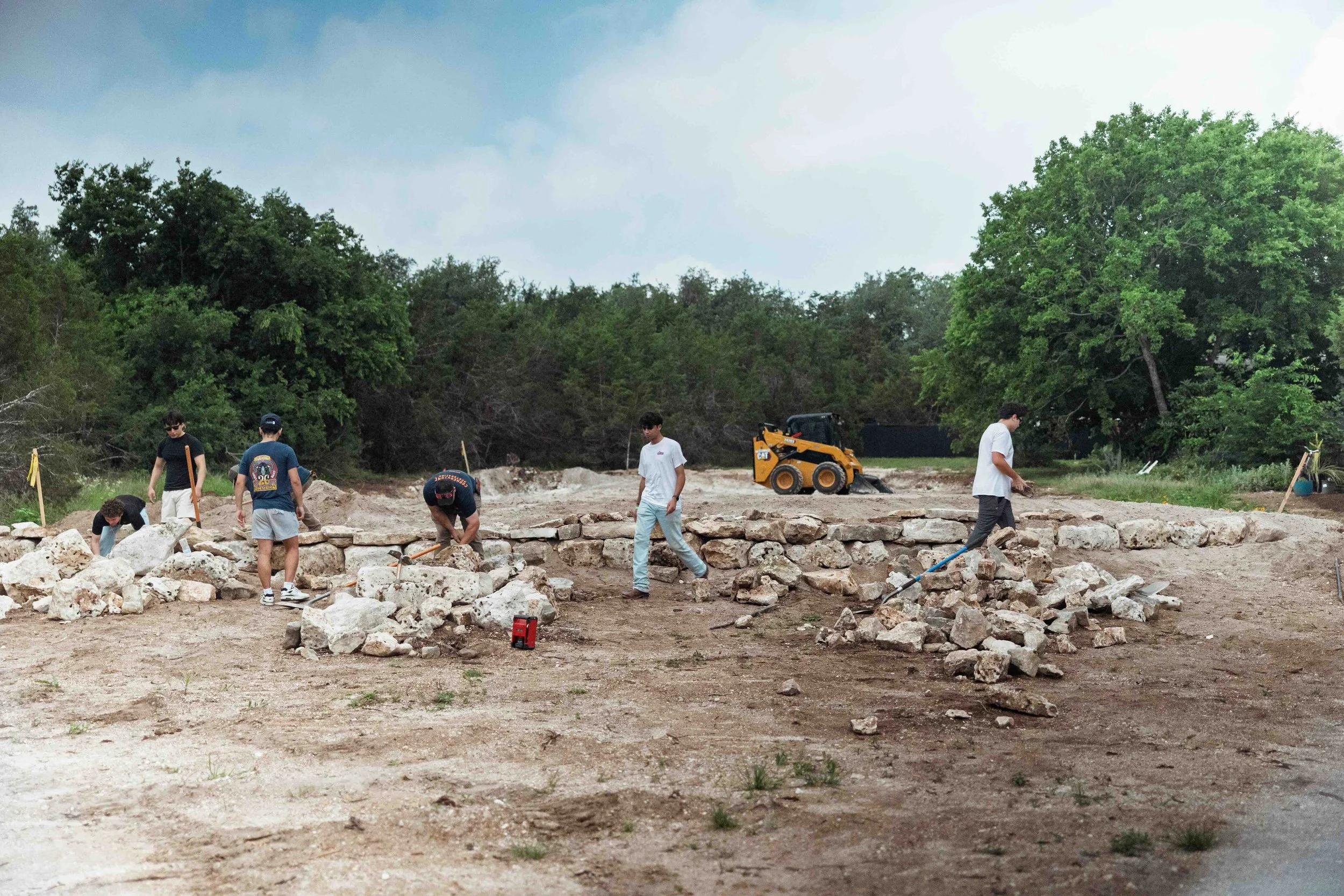Volunteers building the New World soccer field