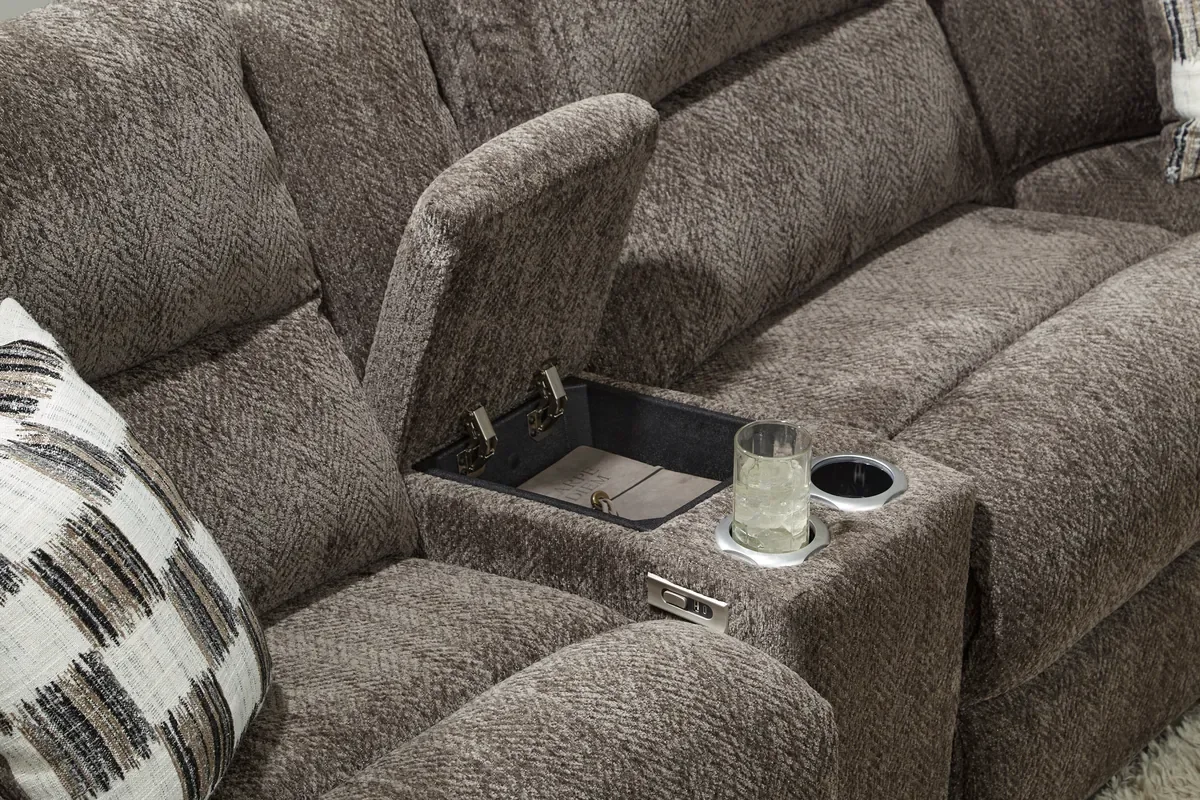 Model 235 center console open, showing the cupholders and storage