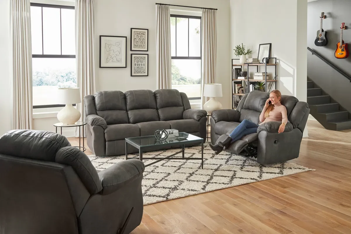 Model 213 reclining sofa group in Tumbleweed in a living room