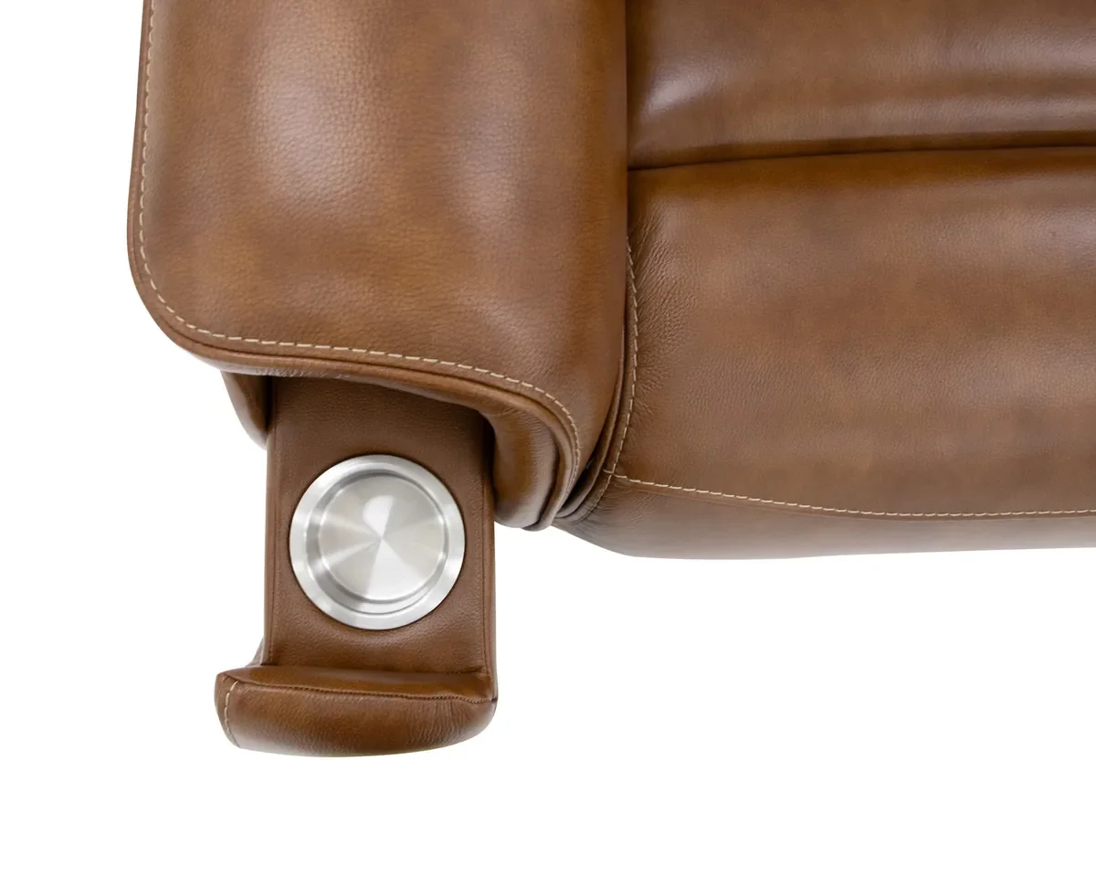 Close-up of the concealed pop-out cupholder in the arm of the Walker recliner in Caramel leather