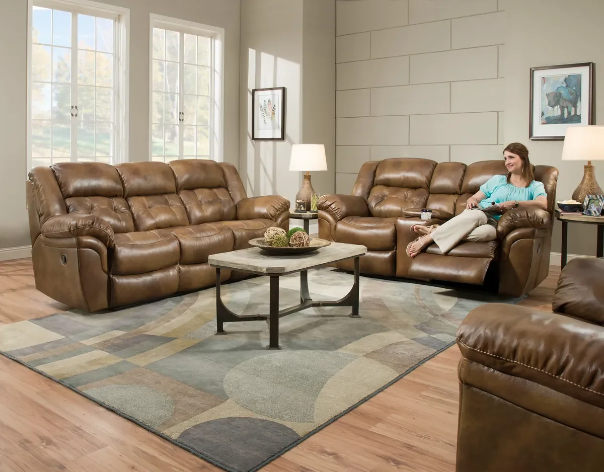 Model 155 reclining sofa group in Saddle in a living room