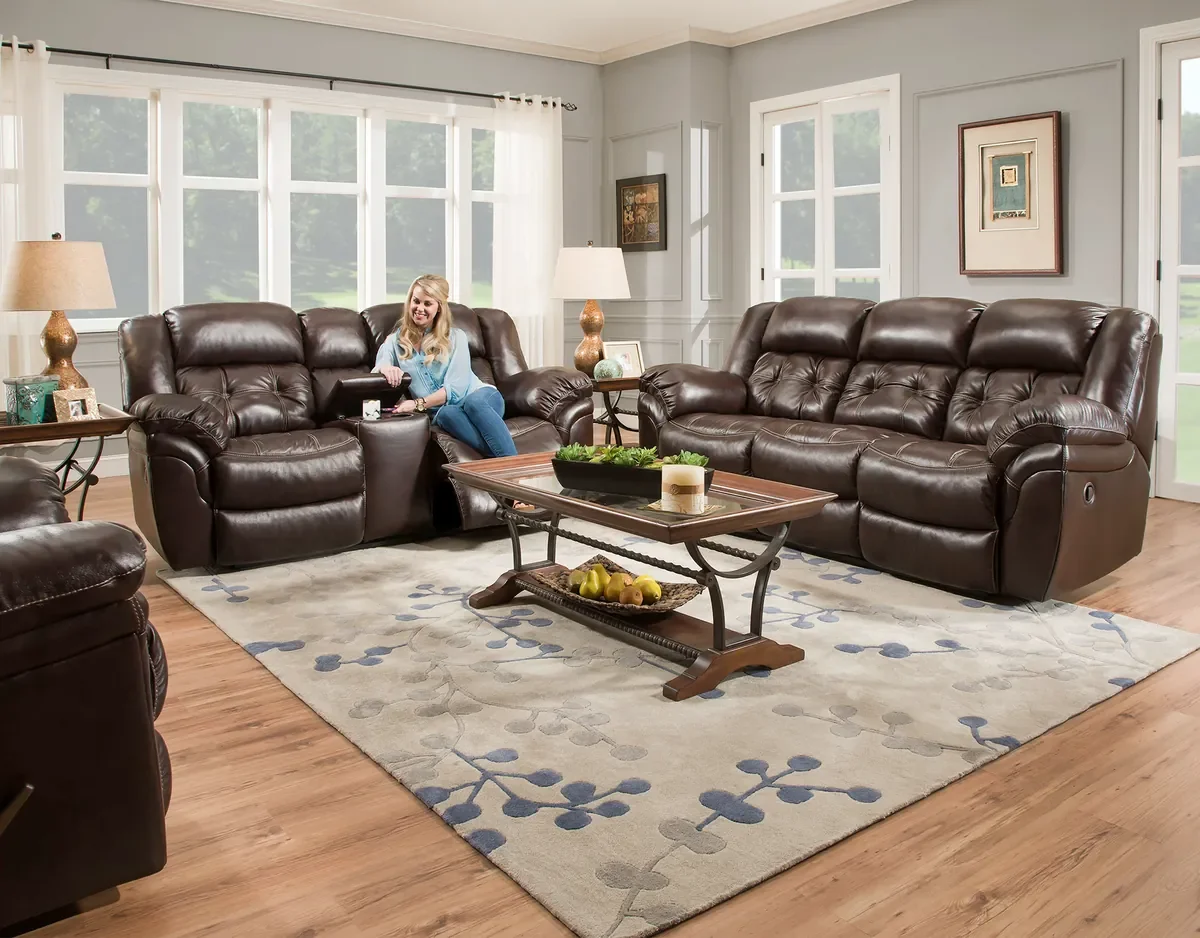 Model 155 reclining sofa group in Whiskey in a living room