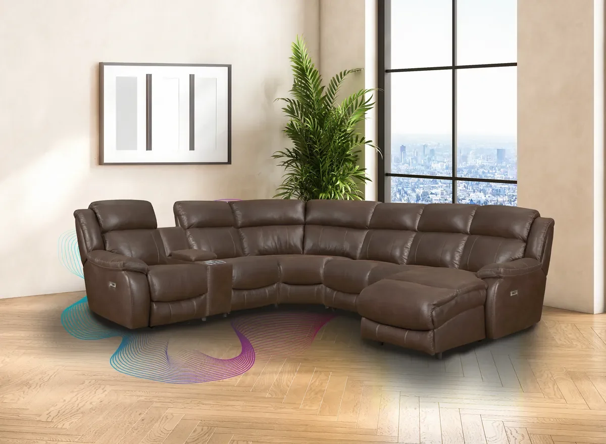 Model 246 modular power sectional in Espresso with a chaise and a console in a bright living room with a city view