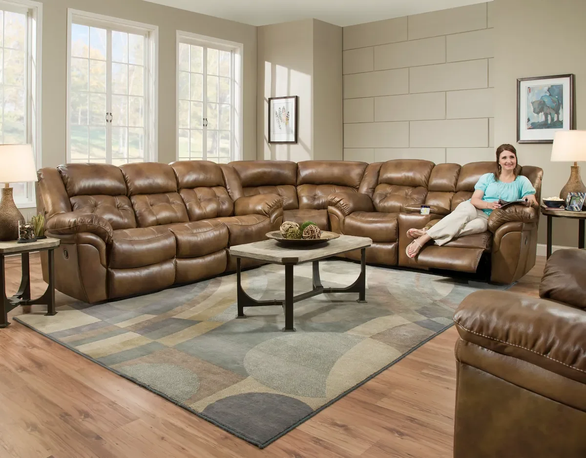 Model 155 reclining sectional in Saddle in a living room