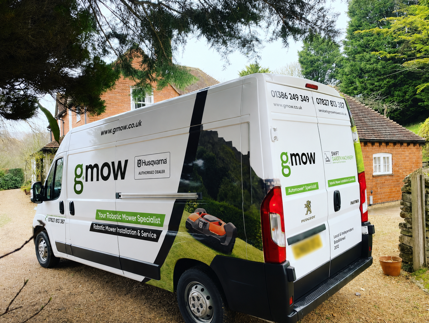 G.MOW service van visiting a customer property