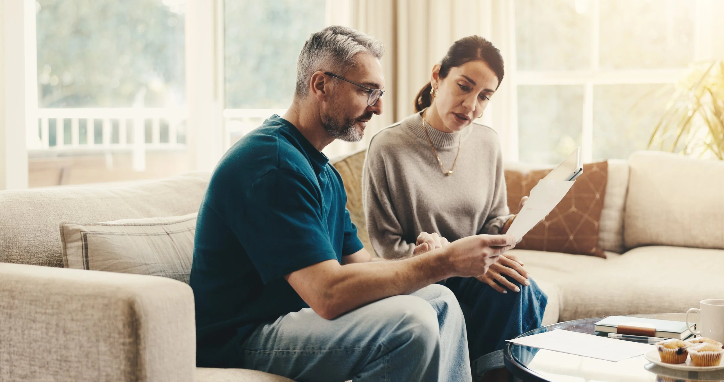Adult couple reviewing important documents together during estate planning