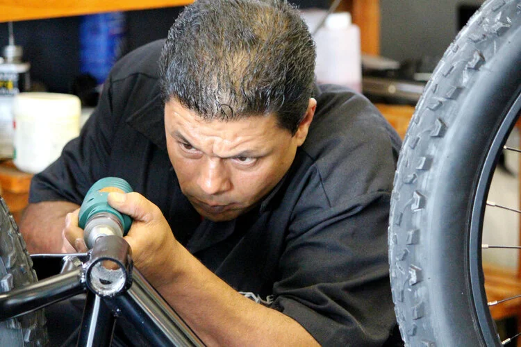 E-bike workshop with tools and parts
