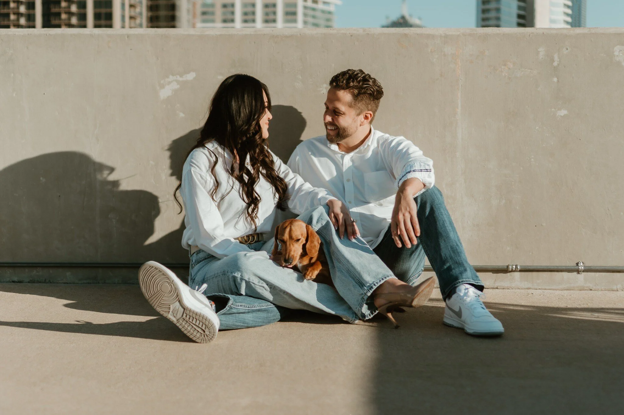 Couple relaxing together with their dog