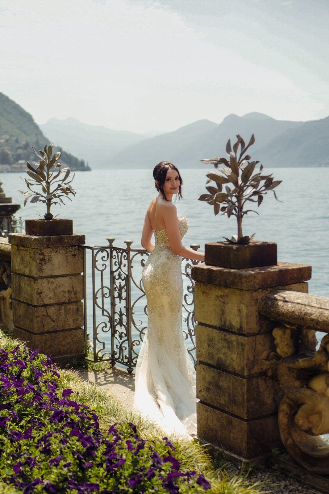 Bride overlooking a mountain lake