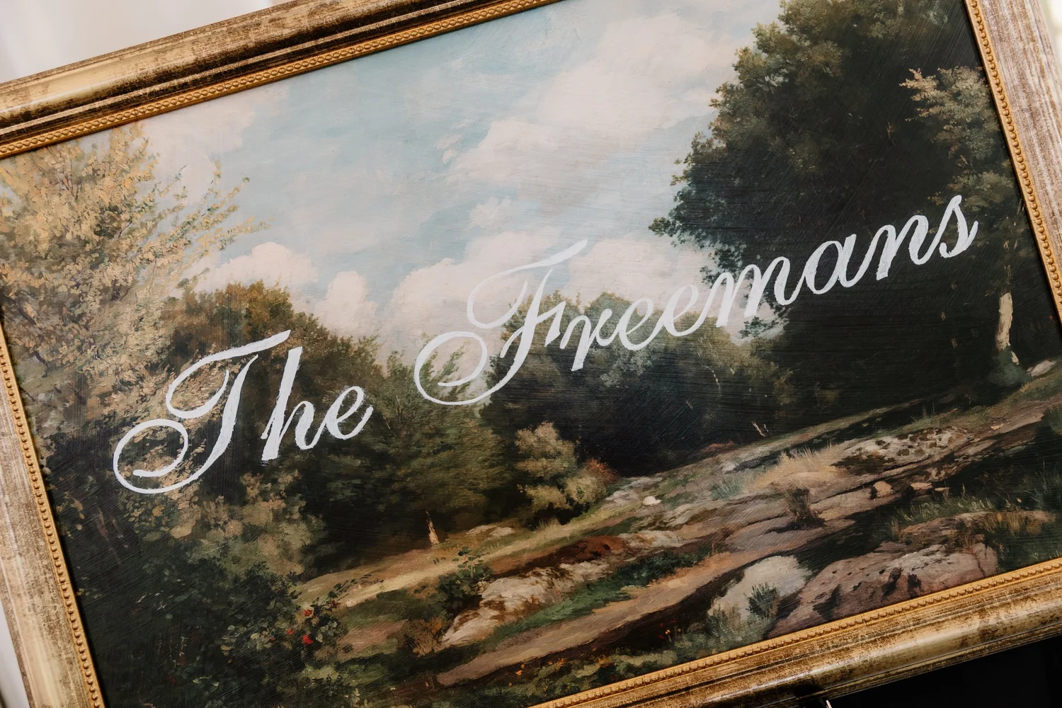 A painted sign with the couple name