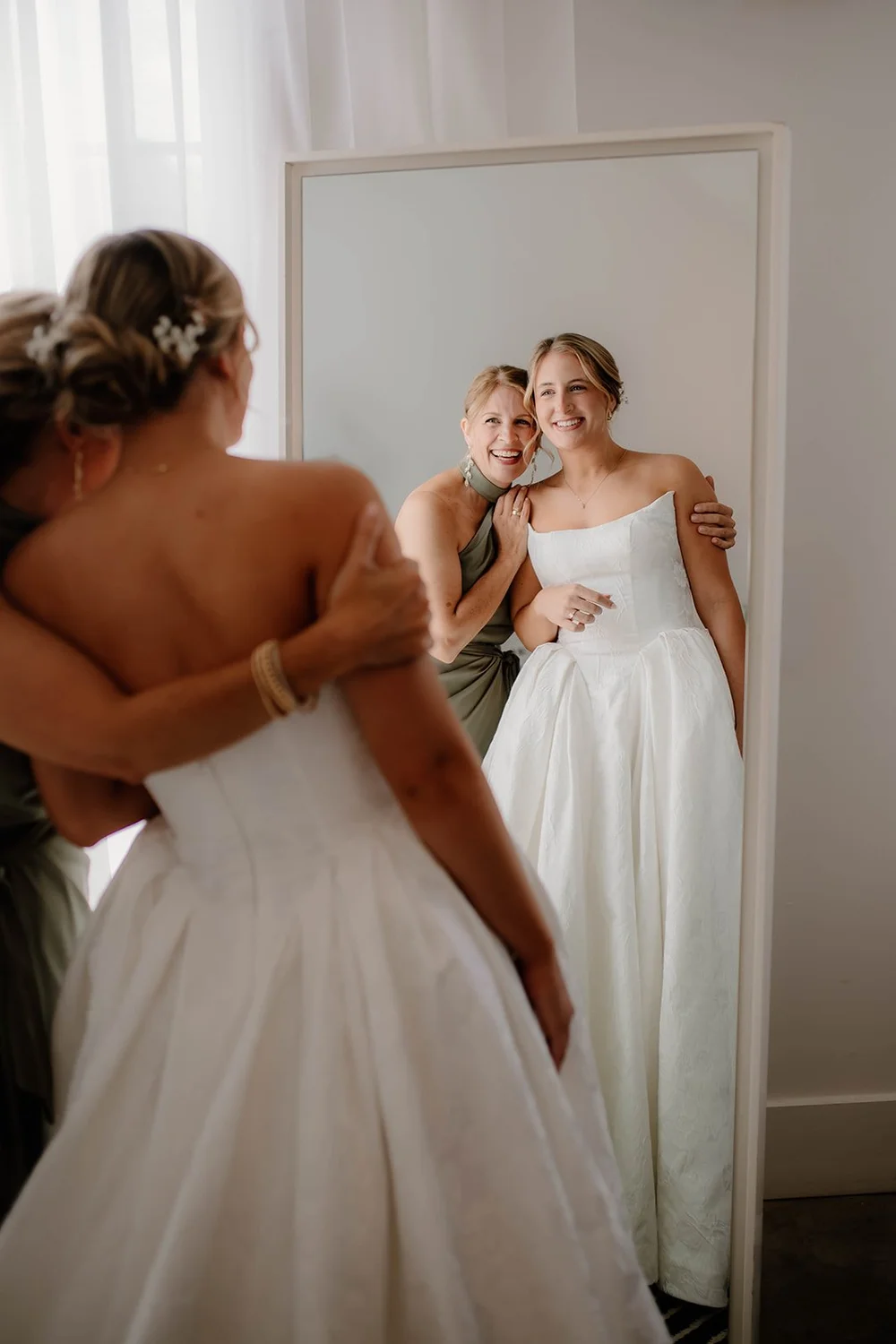 Two brides holding each other