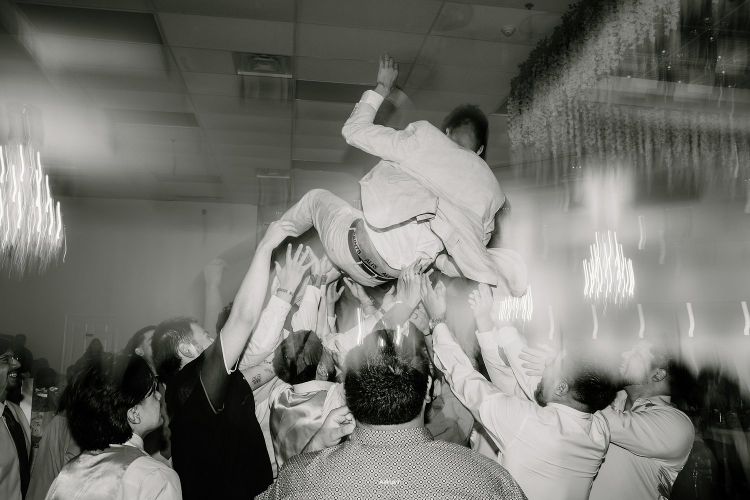 A couple caught mid-laugh on the dance floor