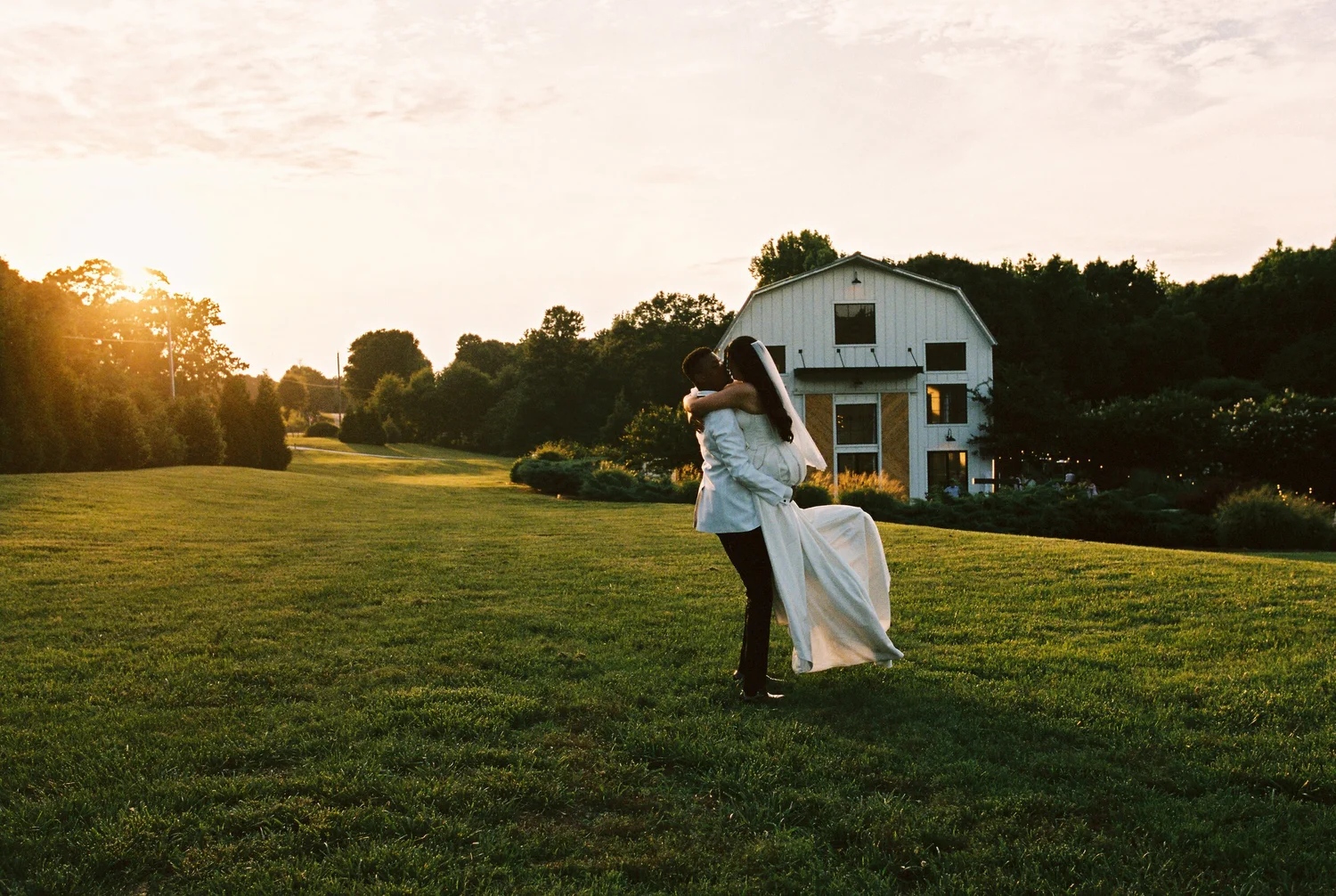 A couple dancing together in the last of the evening light, shot on 35mm film
