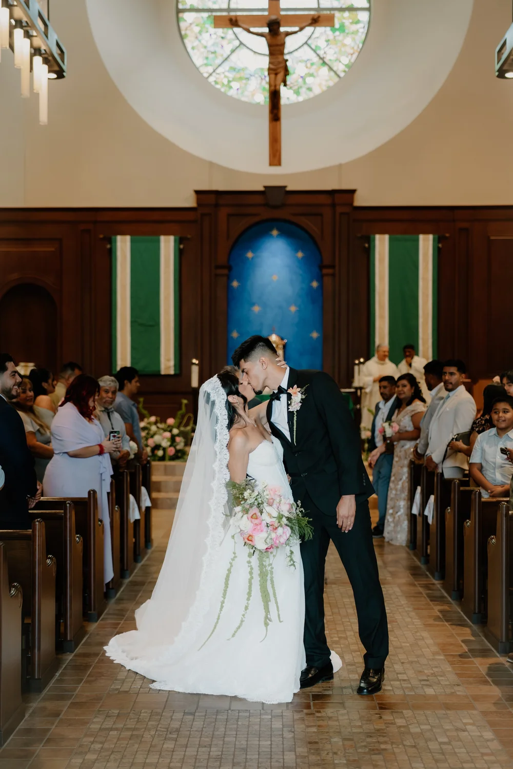 First kiss at the altar during a Catholic ceremony