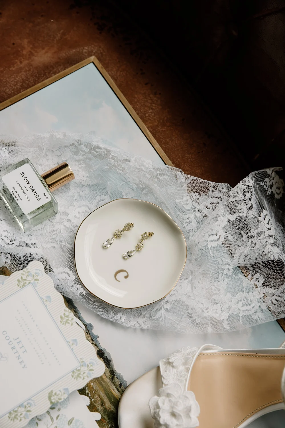 Earrings resting on a dish