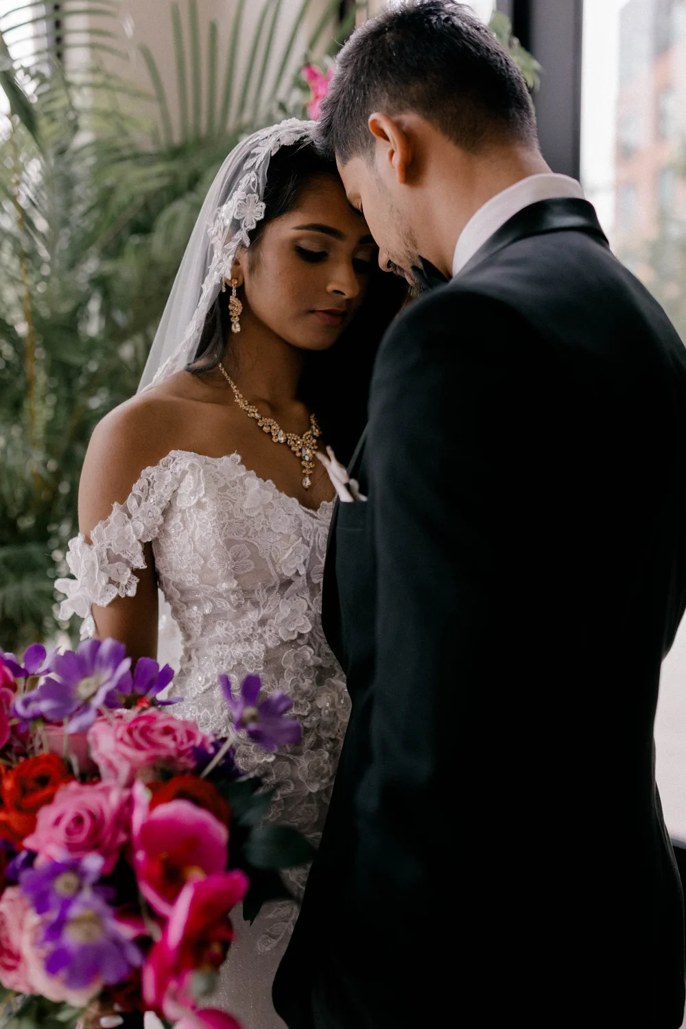 A bride in jewel-toned florals