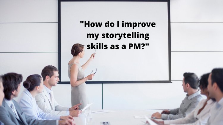 Woman in white dress giving a presentation on “How to I improve my storytelling skills as a PM?” holding a pointer stick and speaking to a meeting room full of co-workers.