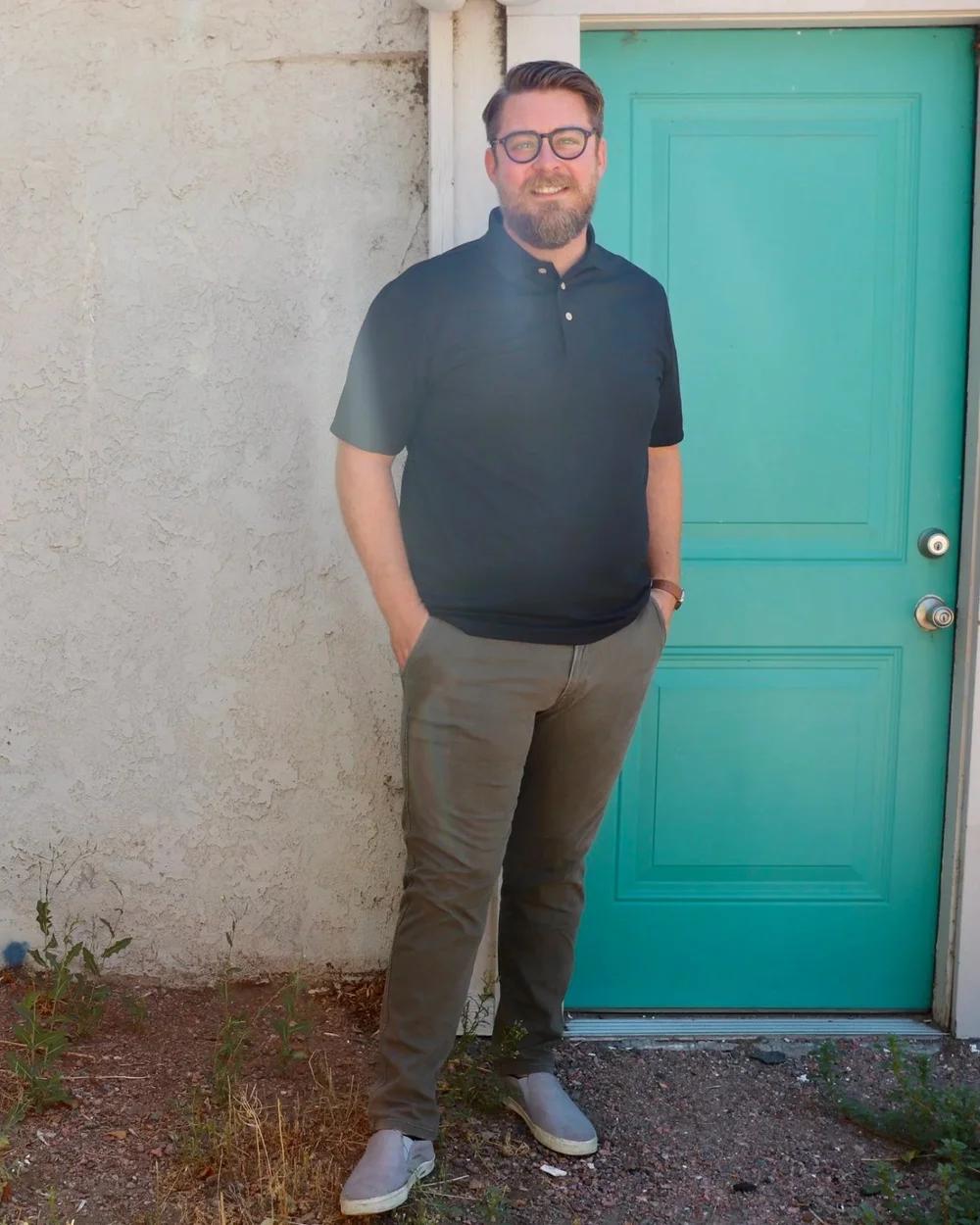Scott Treas, young adult and ADHD coach, standing by a teal door