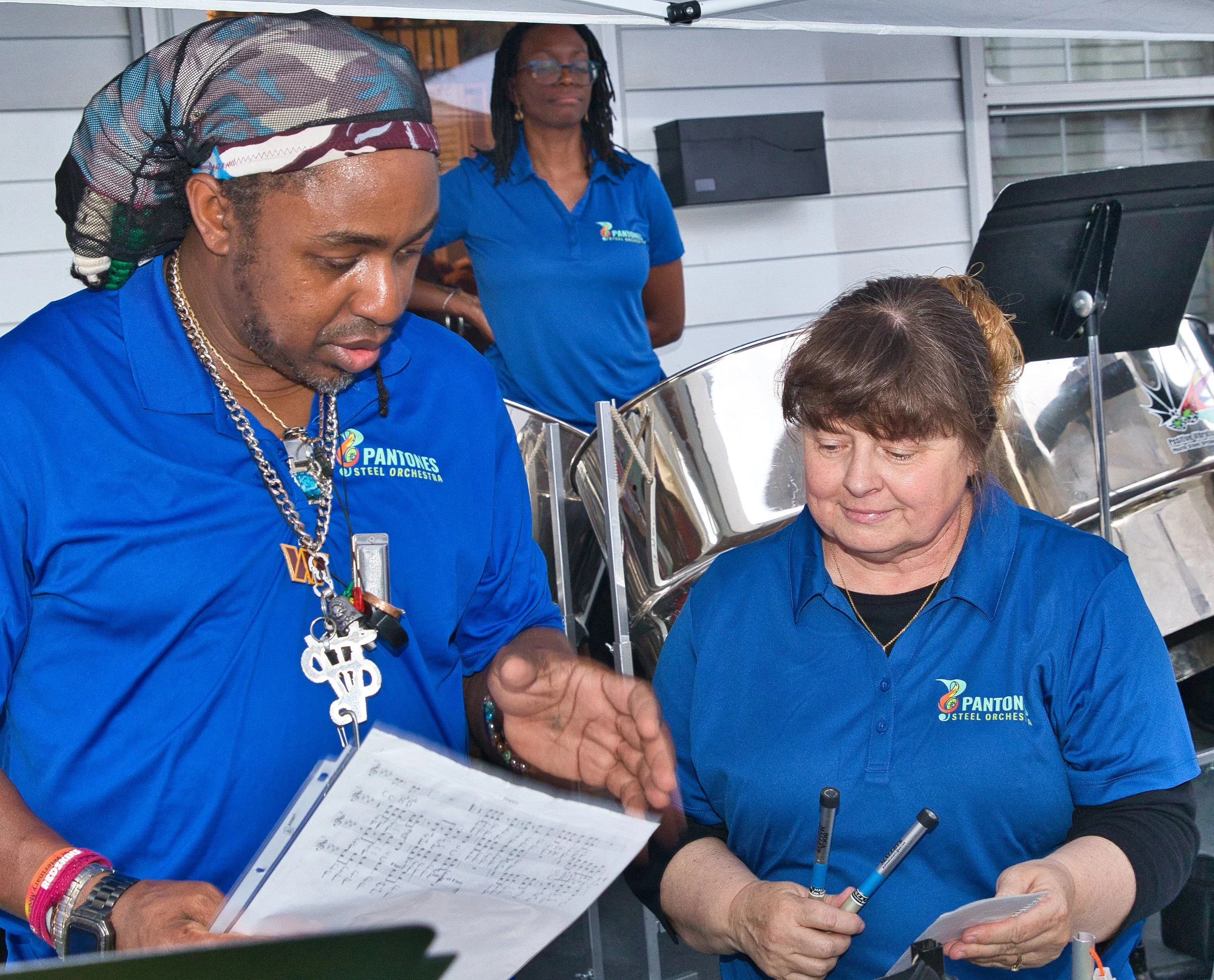 Adult steelpan class in session at CAFE