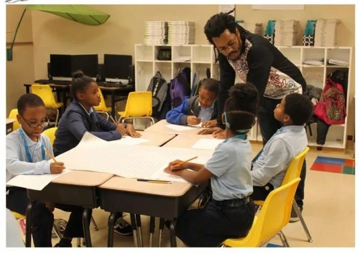 CAFE students engaged in a writing and arts activity during the After School Academy
