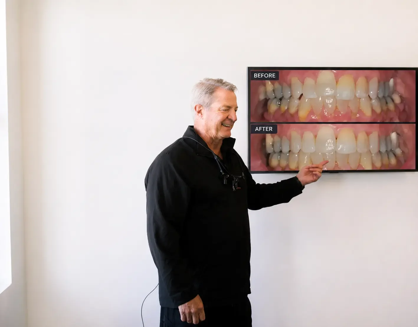 Dr. Michael Teuscher explaining a cosmetic dentistry case to a patient