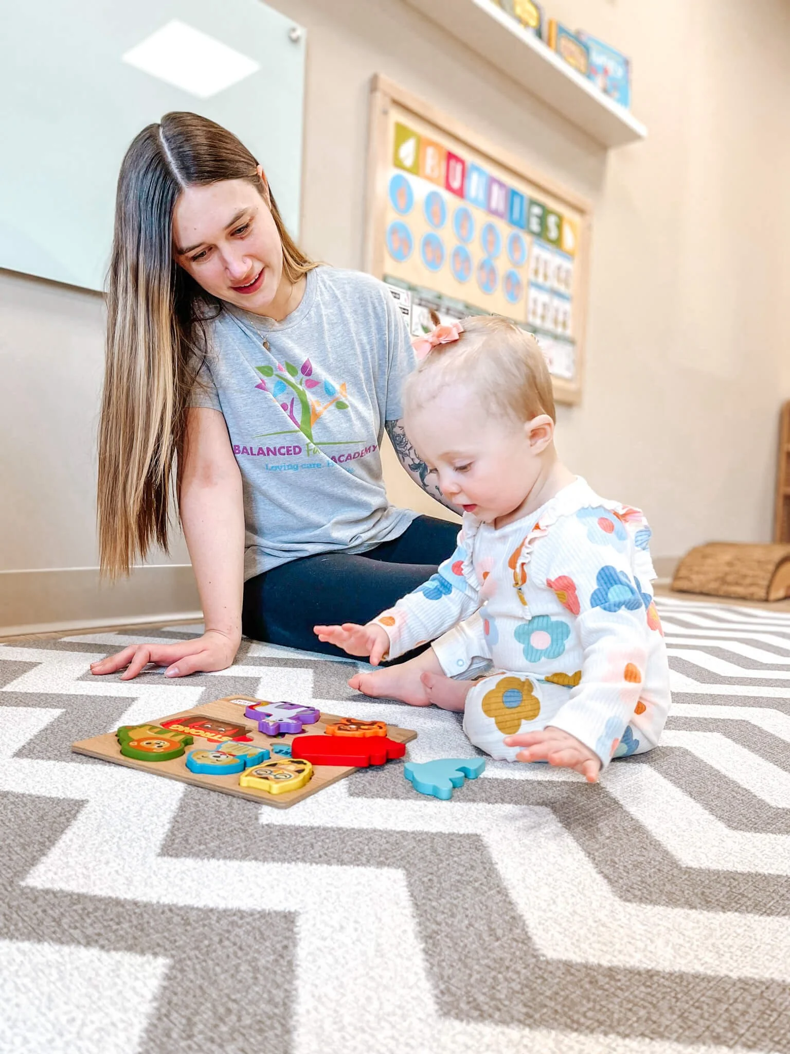 BFA teacher caring for a baby