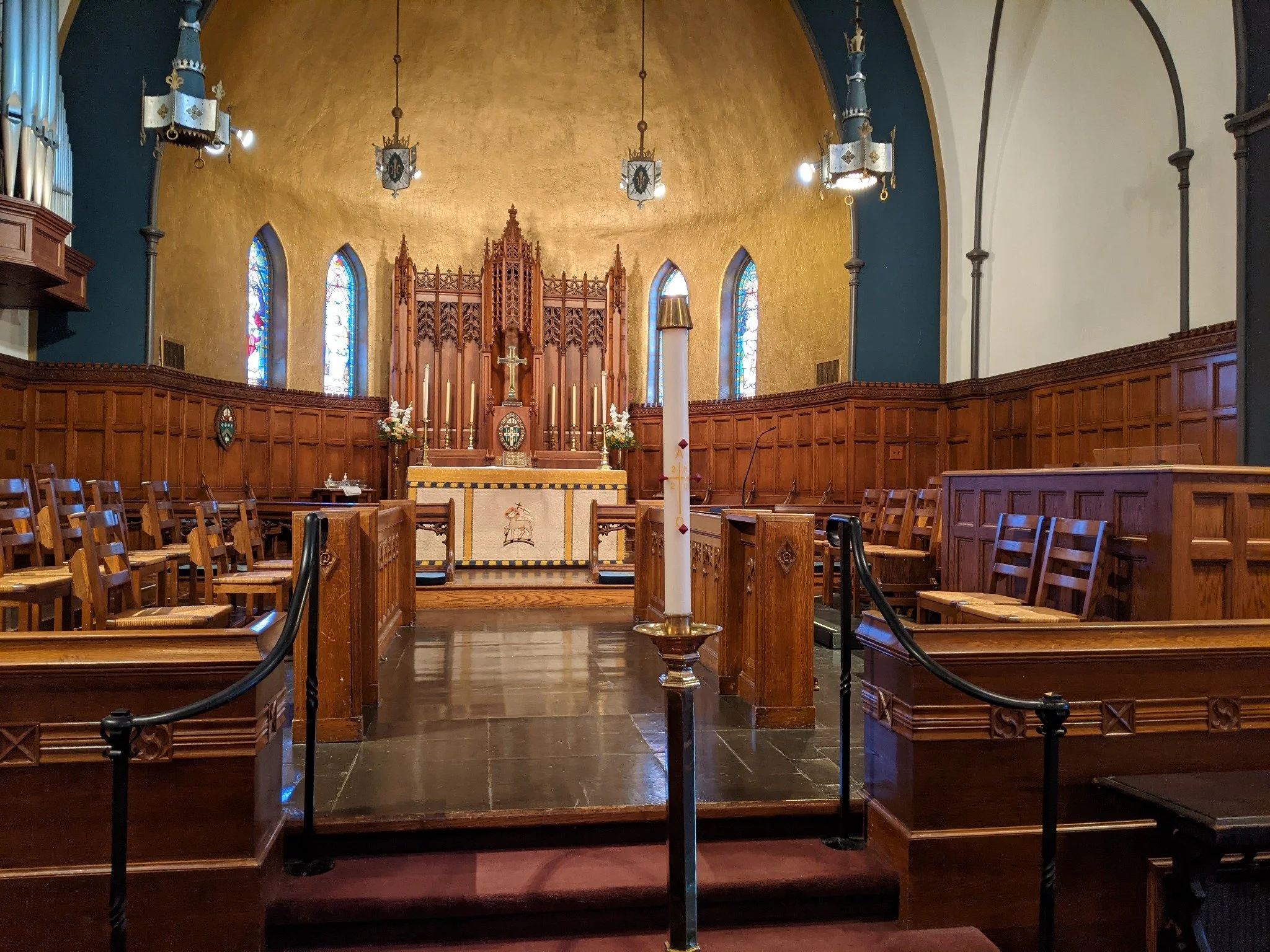 The altar, cross, and Paschal candle in the sanctuary of St. Paul’s Episcopal Cathedral.