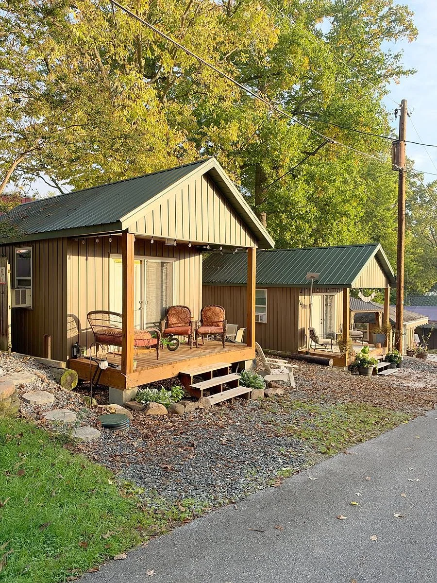 Two seasonal cabins with porches in the sun at Gamler's