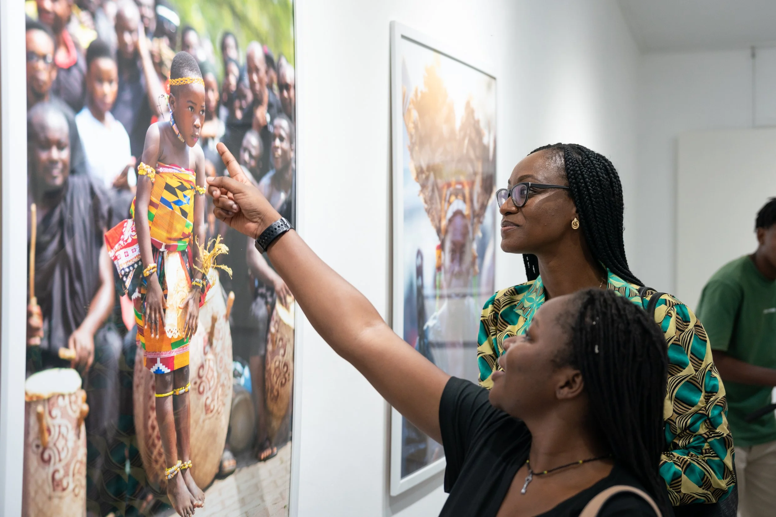 Visitors looking at photographs at Ahenfie.