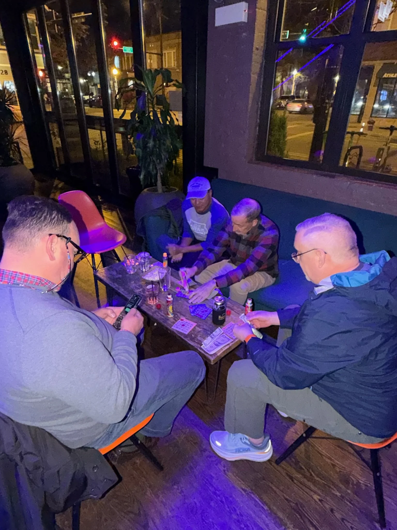 Guests enjoying live free entertainment at Meeting House Tavern, one of Chicago's best LGBTQ+ neighborhood bars in Andersonville
