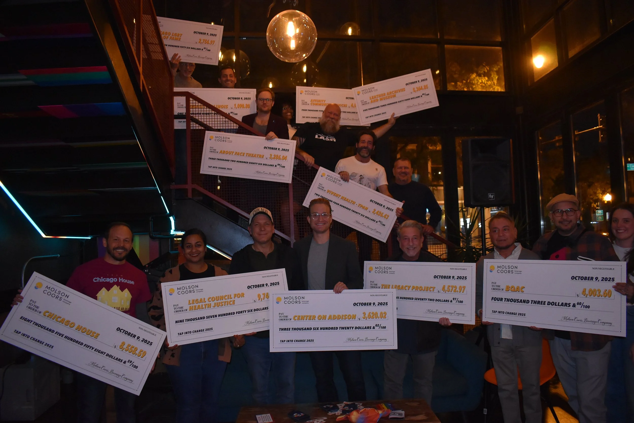 Lively crowd at Meeting House Tavern, Andersonville's welcoming LGBTQ+ neighborhood bar in Chicago