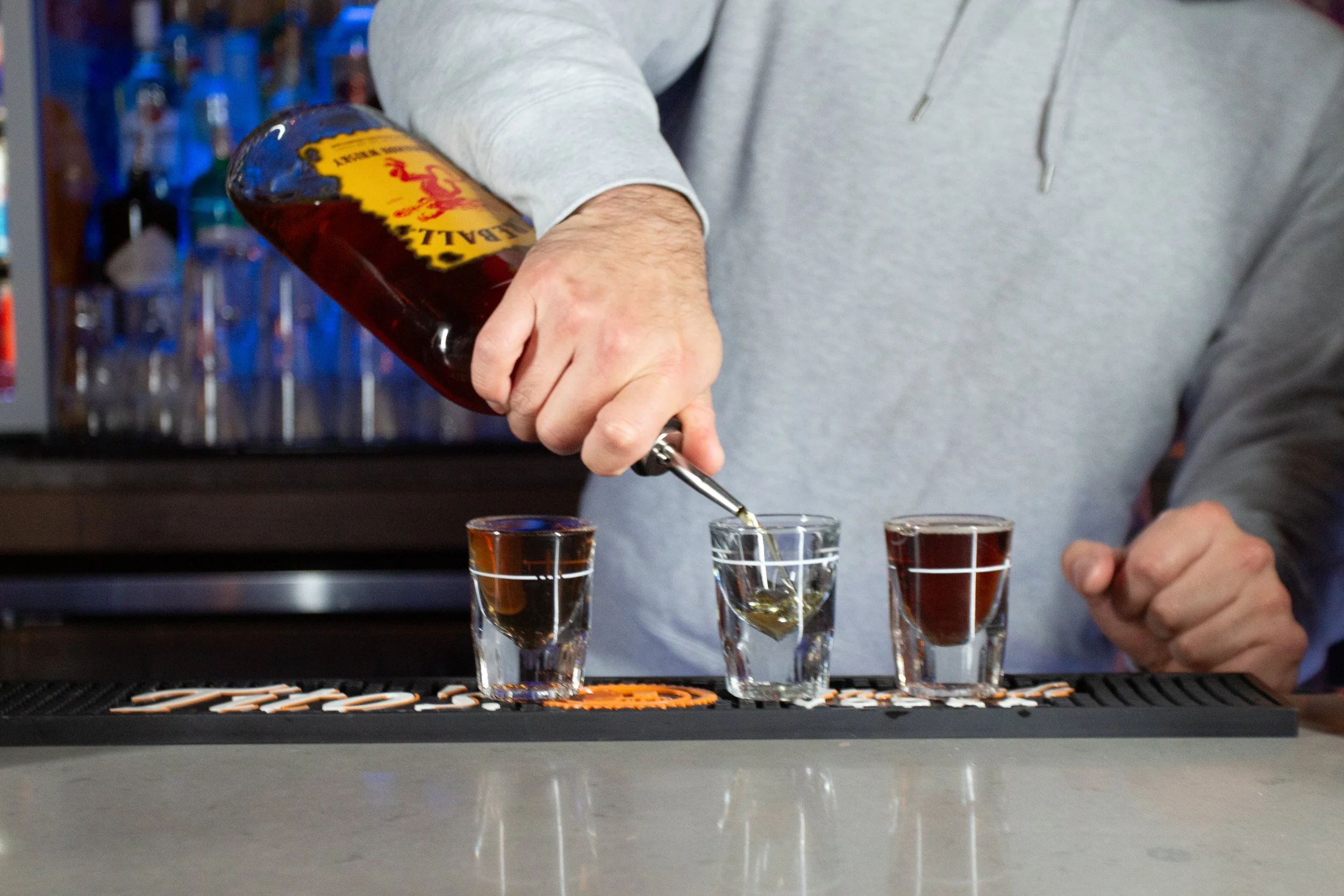 Bartender serving drinks at Meeting House Tavern LGBTQ+ bar Andersonville