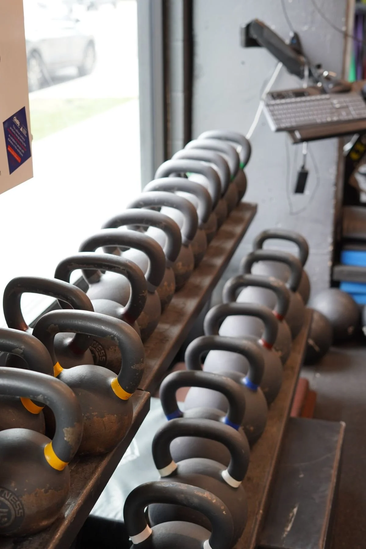Two rows of kettlebells