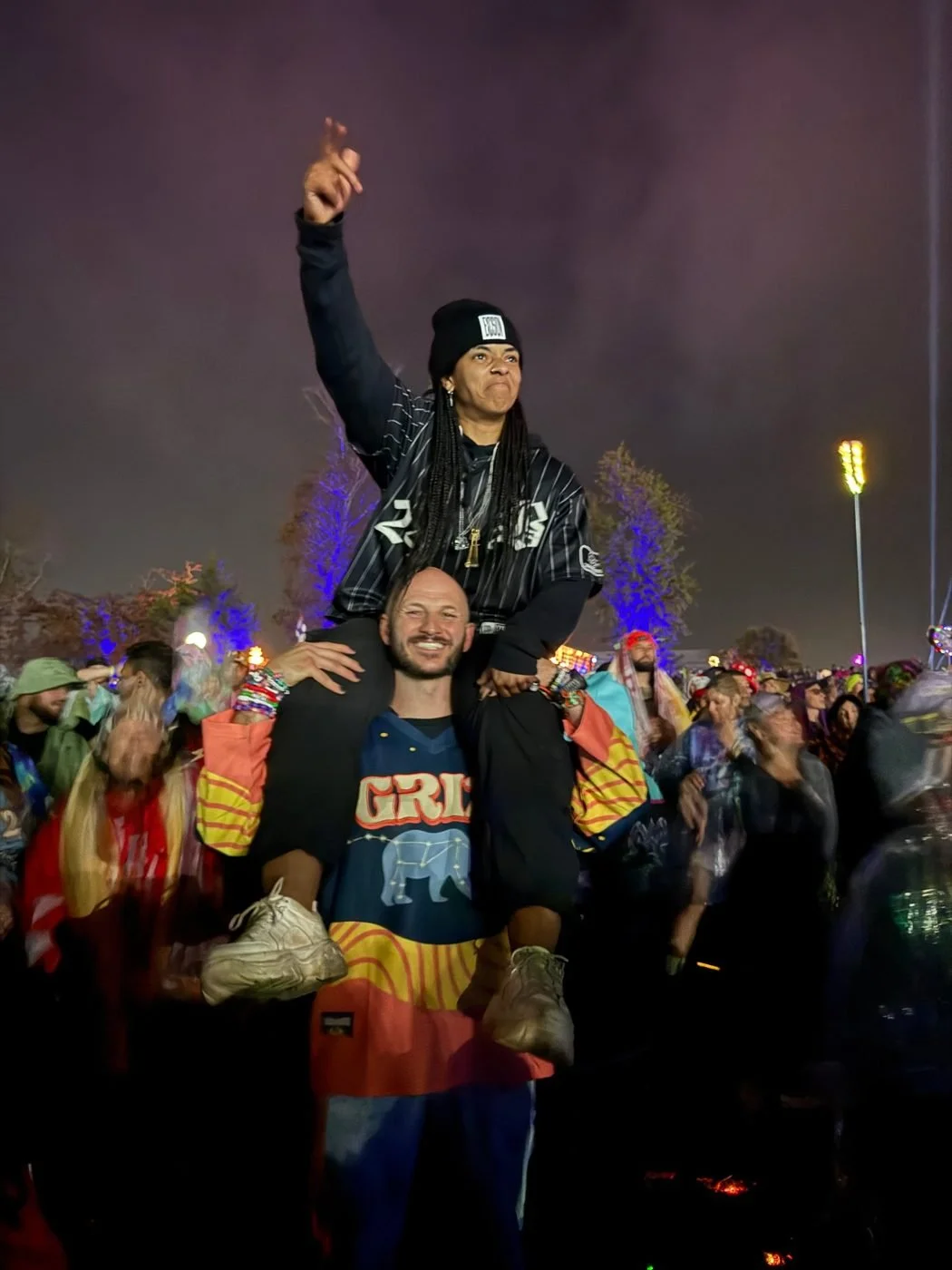 Coach April off the platform, celebrating at a concert