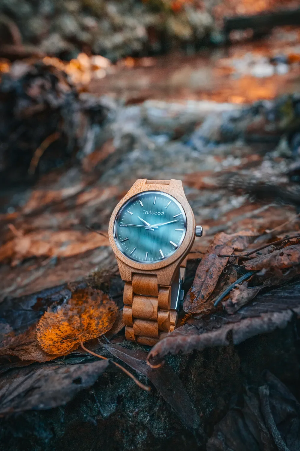 TruWood wooden watch photographed beside a stream